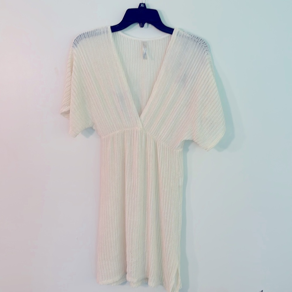 Women’s size medium swimsuit cover-up color is ivory